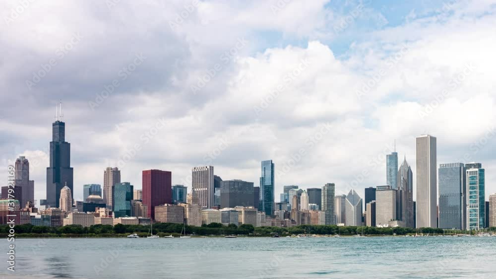Time lapse of partly cloud skies flowing over the Chicago skyline and Lake Michigan on a summer day Time lapse of partly cloud skies flowing over the Chicago skyline and Lake Michigan on a summer day
