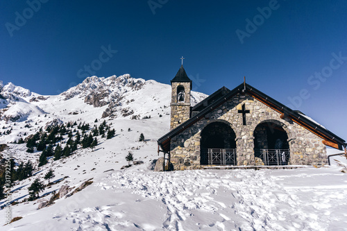 A church in the mountains near the town of Borno, Italy - December 2019.