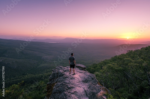 A guy standing on reeds lookout in the Grampians national park  Australia