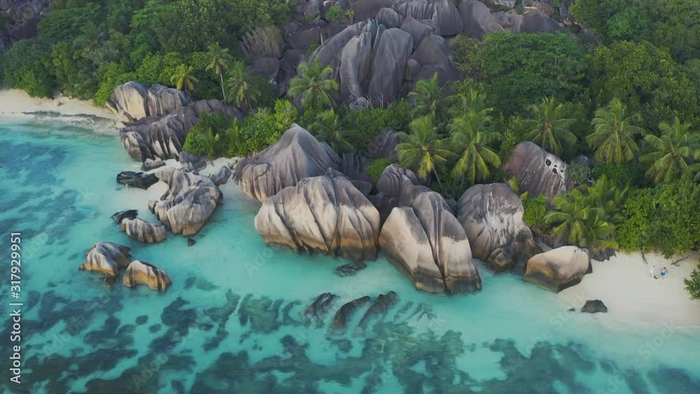 Aerial drone view on the beautiful white sand rocky beach in the seychelles, La digue silver bay