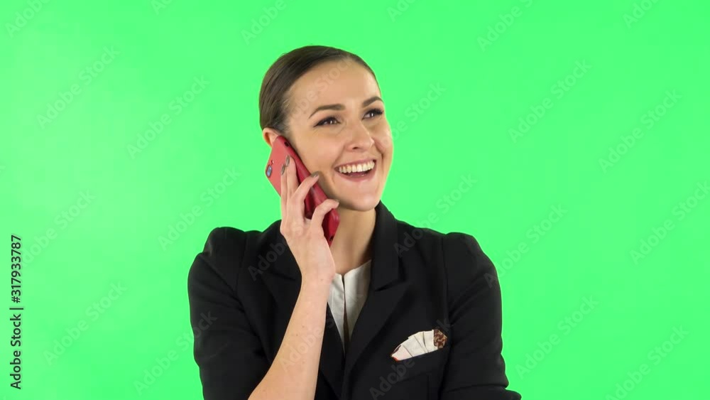 Smiling girl talking for mobile phone and rejoice. Green screen Smiling girl talking for mobile phone and rejoice. Green screen