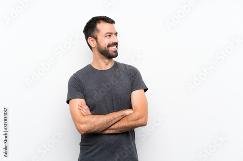 Young handsome man over isolated white background happy and smiling