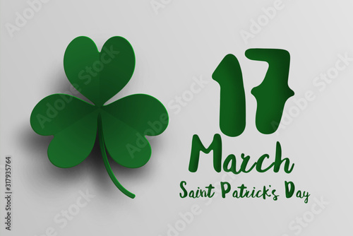 Green clover leaf in paper cut and St. Patrick's Day background