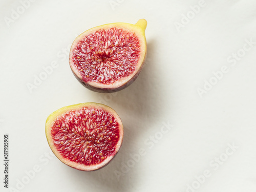 Sliced fresh figs on a white background. Top view. 