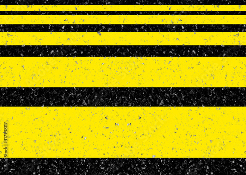 Bandes jaunes peintes sur asphalte 