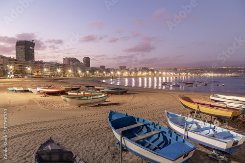 Sunrise on Las Canteras beach in Las Palmas de Gran Canaria, canary islands, Spain. .Canary and beach holidays concept. photo