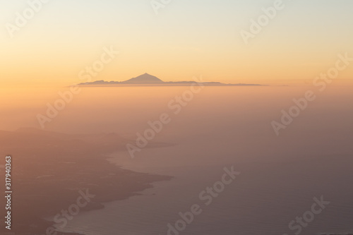 Wonderful aerial views at sunset of el Teide  seen from Gran Canaria  Tenerife  Canary Islands  Spain. .The highest mountain in Spain. Canary islands concept.