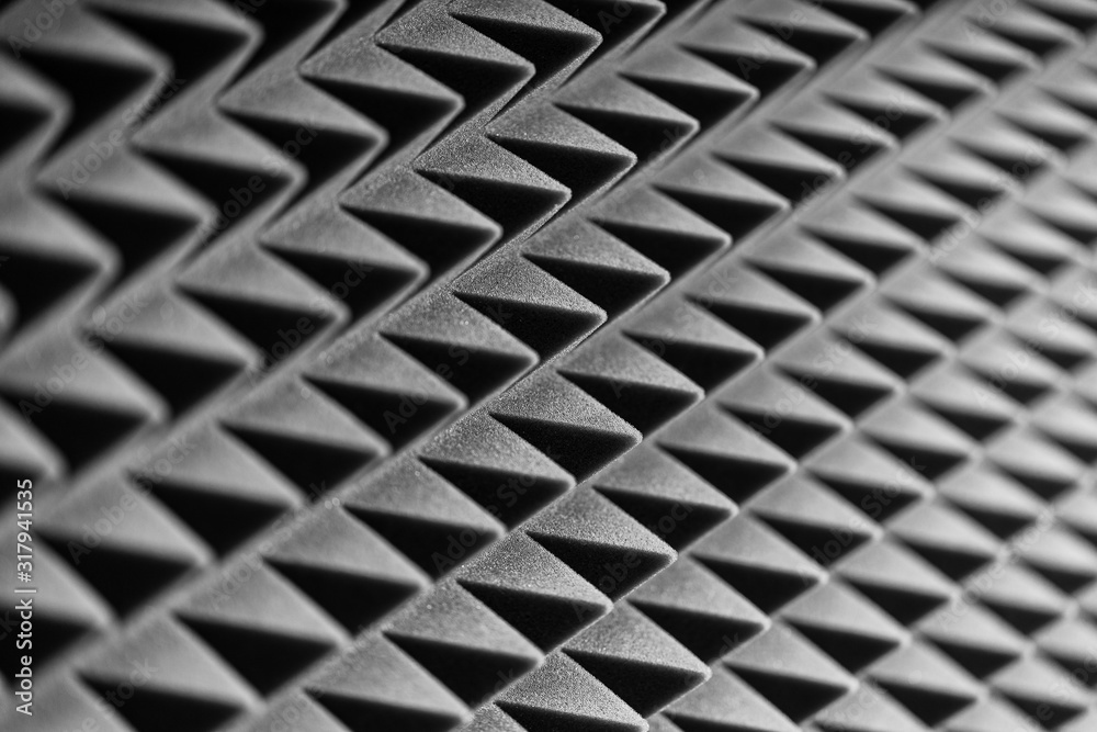Grey acoustic foam pyramid repeating background for music Studio. Black and white. Grey acoustic foam pyramid repeating background for music Studio. Black and white.