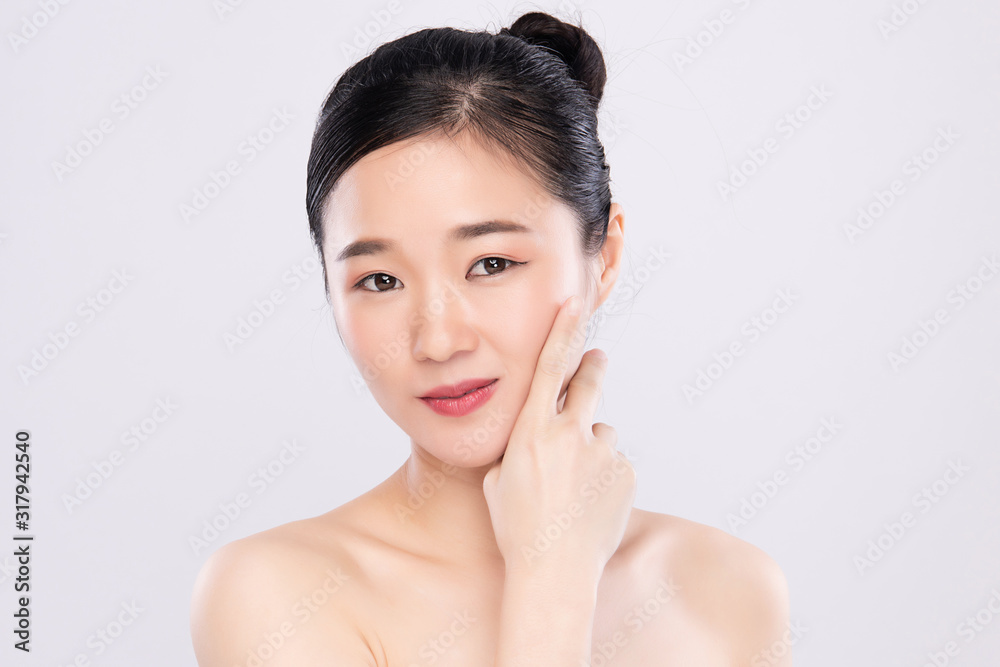 Beautiful Young Asian Woman with Clean Fresh Skin. Face care, Facial treatment, on white background, Beauty and Cosmetics Concept. Beautiful Young Asian Woman with Clean Fresh Skin. Face care, Facial treatment, on white background, Beauty and Cosmetics Concept.