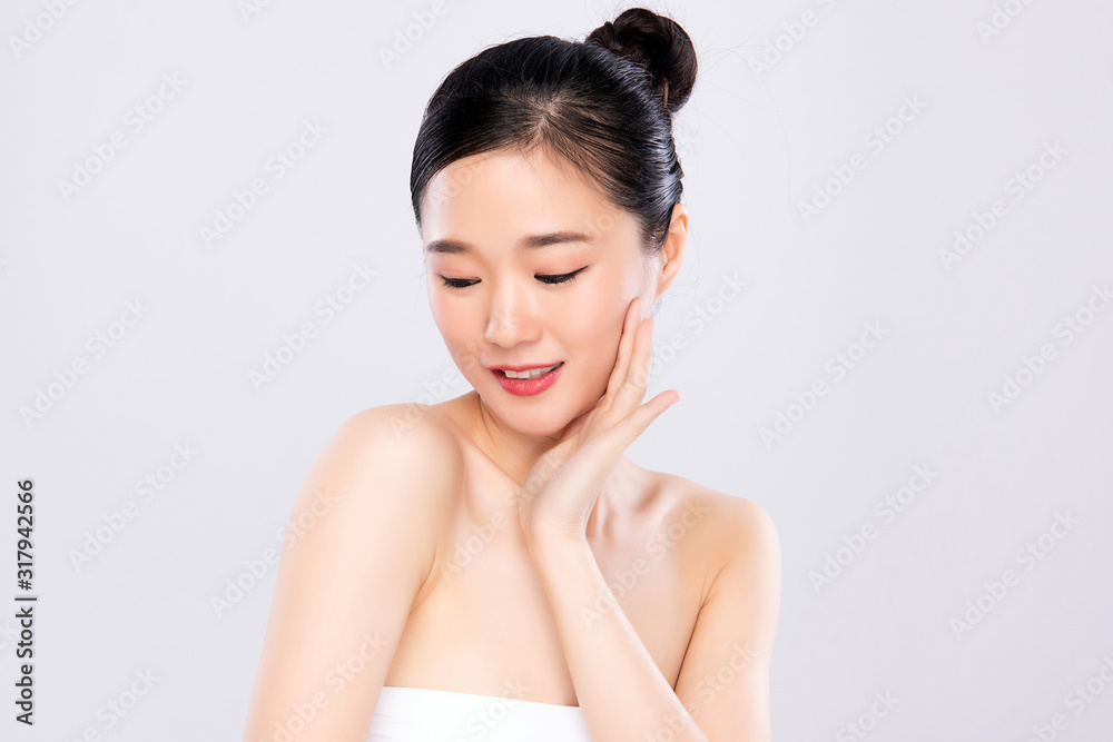 Beautiful Young Asian Woman with Clean Fresh Skin. Face care, Facial treatment, on white background, Beauty and Cosmetics Concept. Beautiful Young Asian Woman with Clean Fresh Skin. Face care, Facial treatment, on white background, Beauty and Cosmetics Concept.