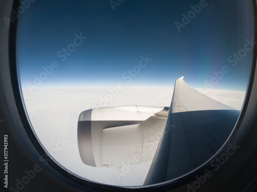 View from a Airplane Window  Above Clouds