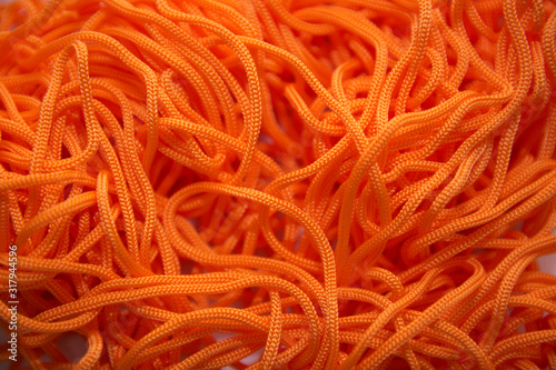 orange thread on a white background close-up