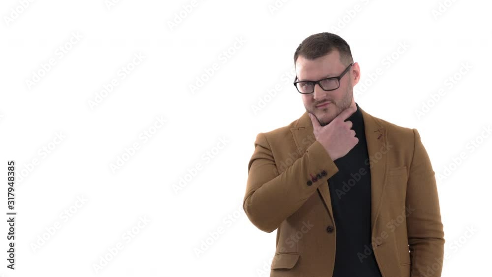 Thoughtful handsome man posing to camera and touching his chin. Emotions, feelings, body language, signs and gestures concept. Isolated, on white background Thoughtful handsome man posing to camera and touching his chin. Emotions, feelings, body language, signs and gestures concept. Isolated, on white background