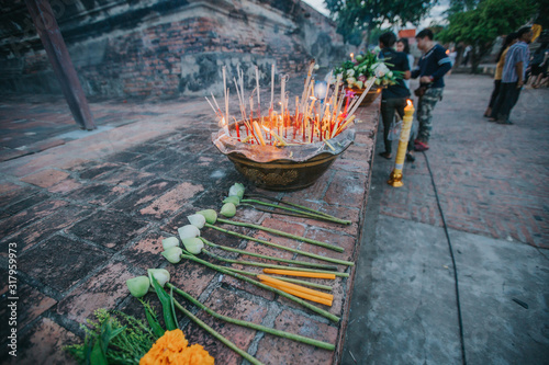 Lotus flowers, candles and incense sticks offered by Thai people at Asahna Bucha Day. photo