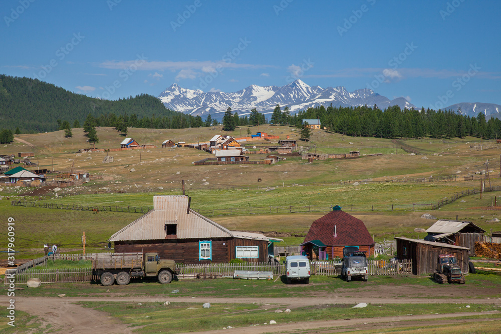 Rural landscape. Village in the mountains of Altai