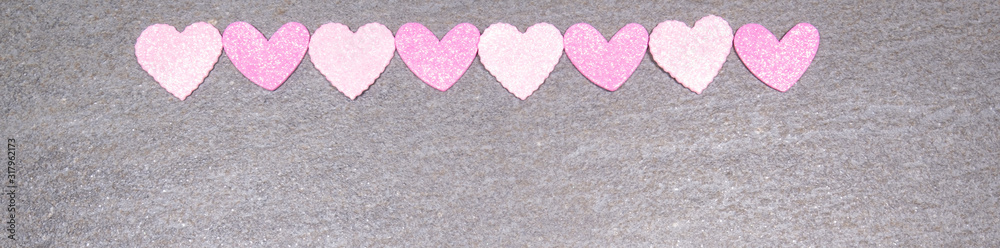 Fototapeta premium gray granite background with pink and white hearts for valentines day. Valentine's day and love concept