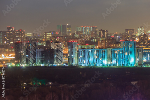 Evening Moscow, Shchukino district is an administrative raion of North-Western Administrative Okrug of Moscow, Russia. The lights of the big city. View above. photo