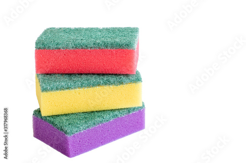 yellow, red and violet sponges isolated on white background
