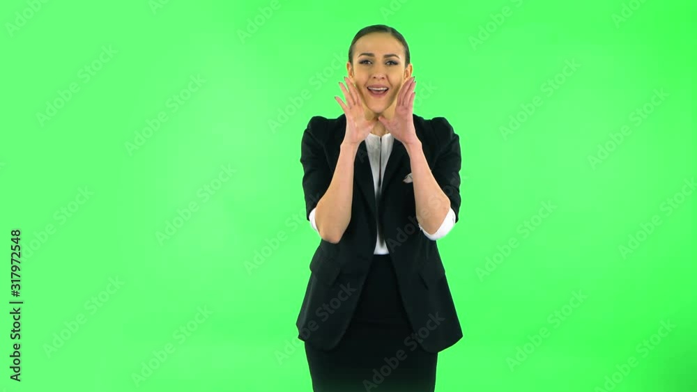Girl screams calling someone on a green screen at studio Girl screams calling someone on a green screen at studio