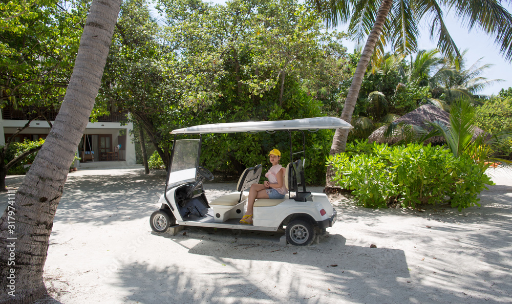 cart girl in a tropical resort