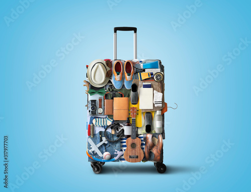 Travel suitcase consisting of items and clothing for vacation, travel concept