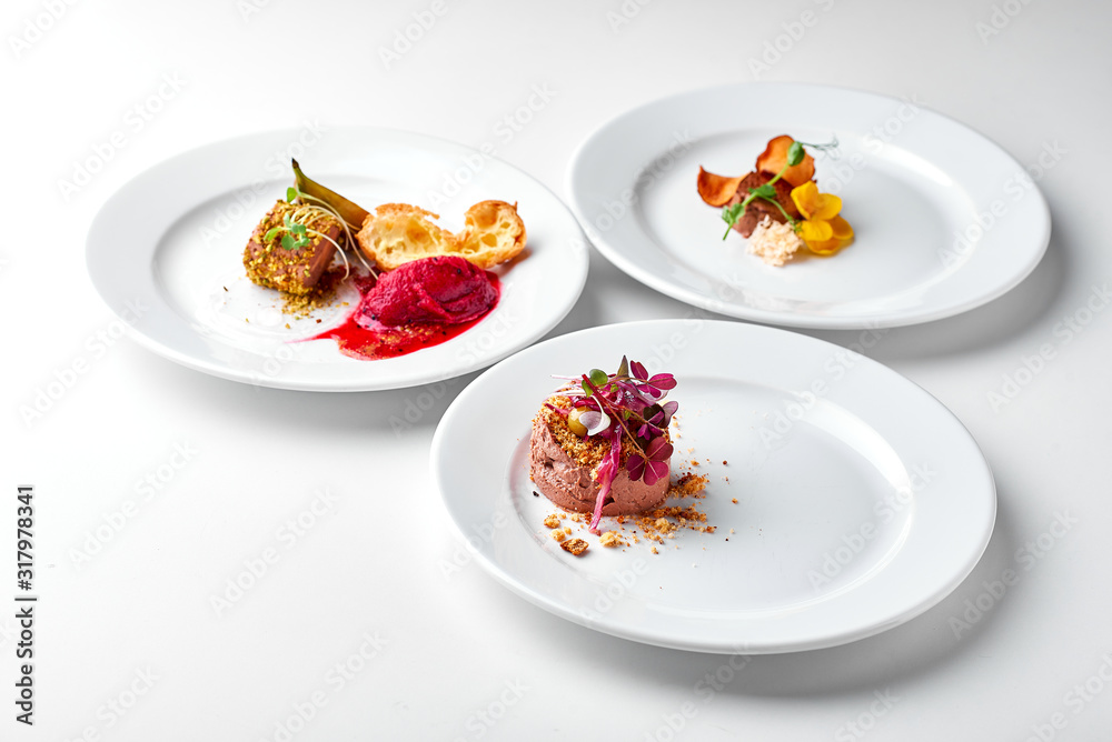 Set Food Menu On A White Plate. Top view of light dish perfect served. Meat pate on a plate Set Food Menu On A White Plate. Top view of light dish perfect served. Meat pate on a plate