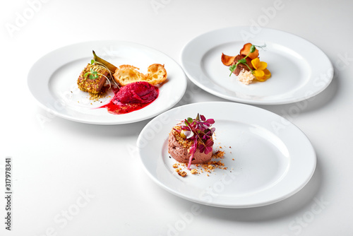 Set Food Menu On A White Plate. Top view of light dish perfect served. Meat pate on a plate