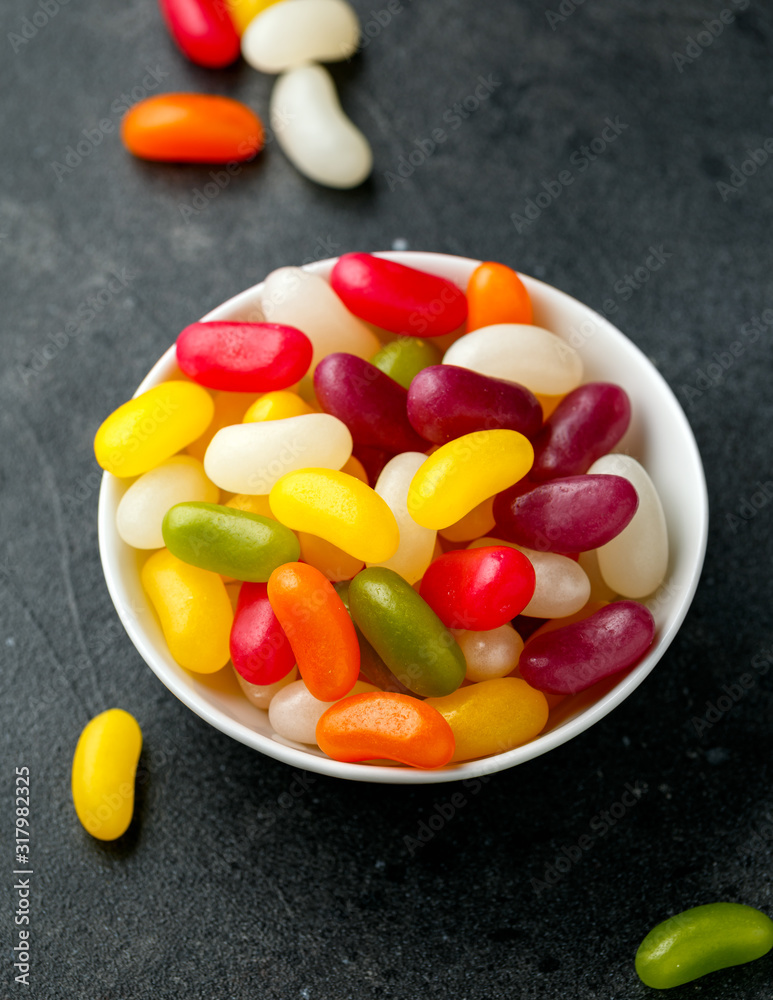 A mix of jelly beans candy in white bowl. sweet food A mix of jelly beans candy in white bowl. sweet food