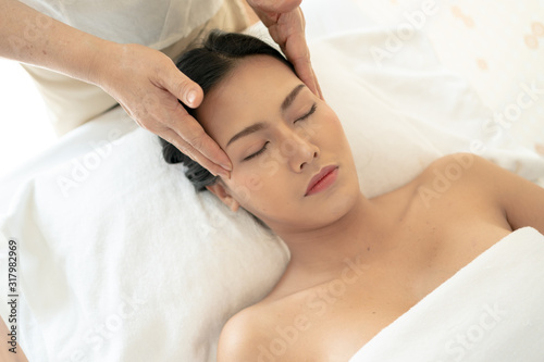 Young Woman during Spa Salon Body massage Hands Treatment.