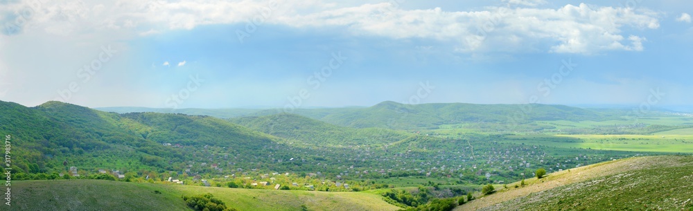 Mountain landscape and small village in distance