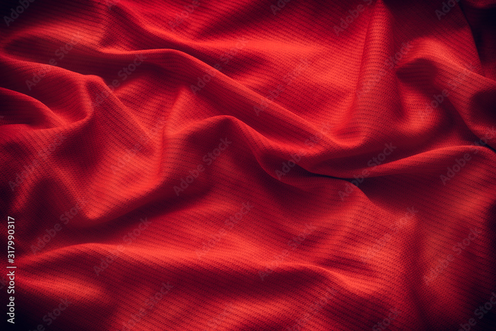 Dark red folded fabric texture background Dark red folded fabric texture background