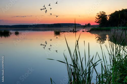 Colorful sunrise over the lake ..