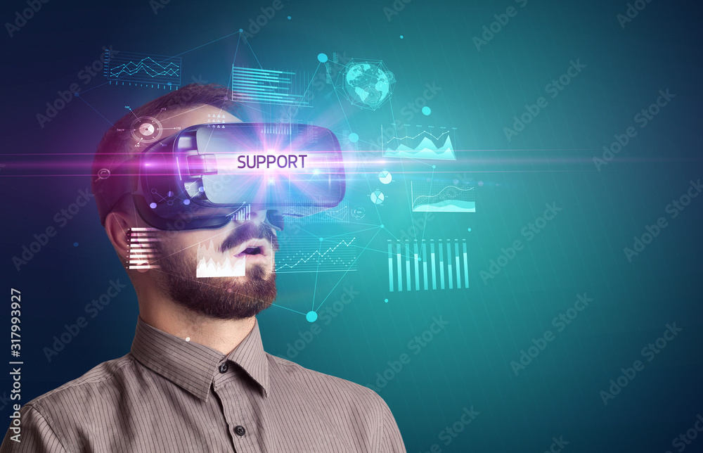 Businessman looking through Virtual Reality glasses with SUPPORT inscription, new business concept Businessman looking through Virtual Reality glasses with SUPPORT inscription, new business concept