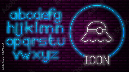 Glowing neon line Elegant women hat icon isolated on brick wall background. Neon light alphabet. Vector Illustration