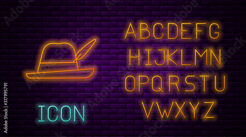 Glowing neon line Oktoberfest hat icon isolated on brick wall background. Hunter hat with feather. German hat. Neon light alphabet. Vector Illustration