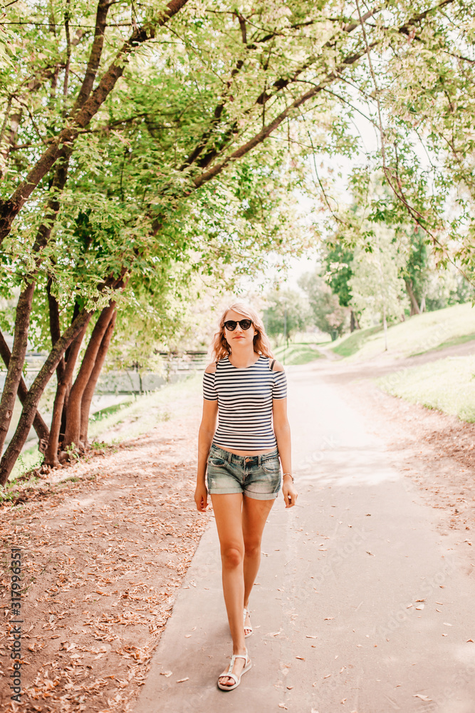 Attractive charming blonde with long legs and hair travels in the summer Attractive charming blonde with long legs and hair travels in the summer