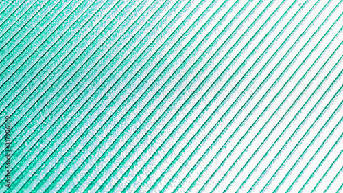 The sunlight shines through a green polycarbonate sheet that can see surfaces and stripes.