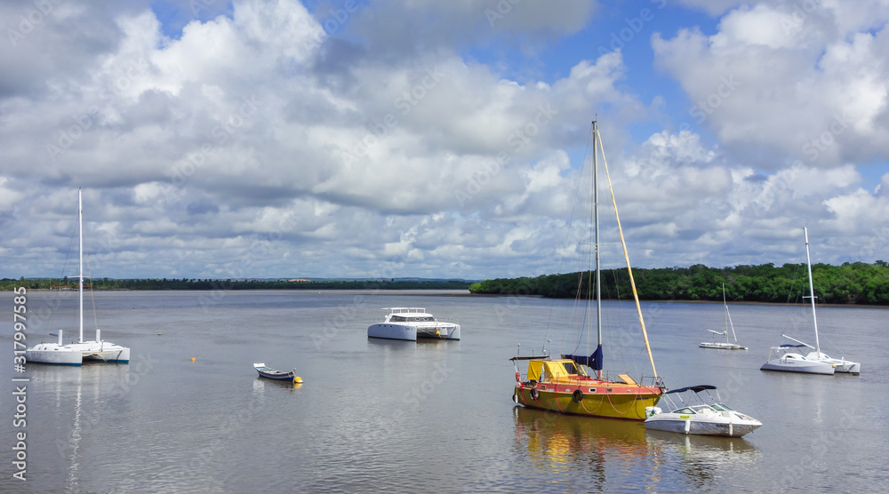 Aracaju/Brazil: sailboats and ships parked at the river bay