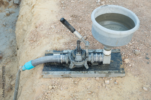 Machine grout pressure pump for grouting non-shrink concrete to precast column