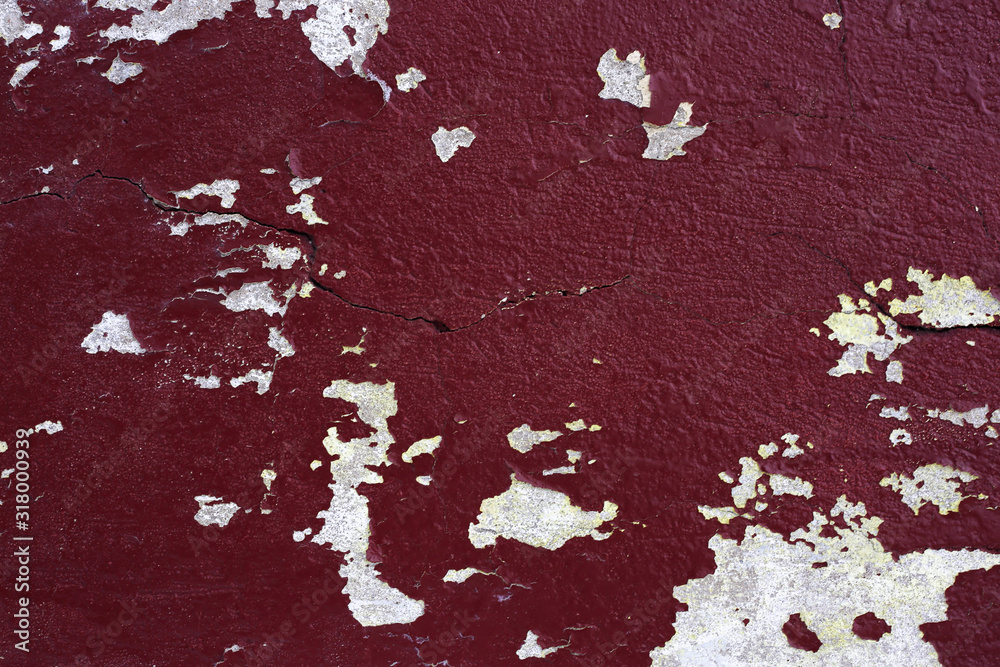 Old peeling paint on a concrete wall. Old peeling paint on a concrete wall.