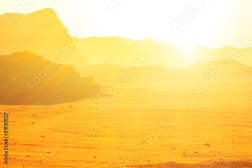 Scenic landscape of Wadi Rum and Valley of the Moon at sunset light in southern Jordan. Popular tourist destination for spectacular sandstone and granite rock. Tourism in Jordan desert. photo