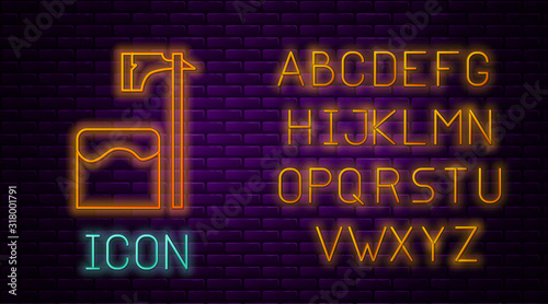 Glowing neon line Executioner axe in tree block icon isolated on brick wall background. Hangman, torturer, executor, tormentor, butcher, headsman. Neon light alphabet. Vector Illustration