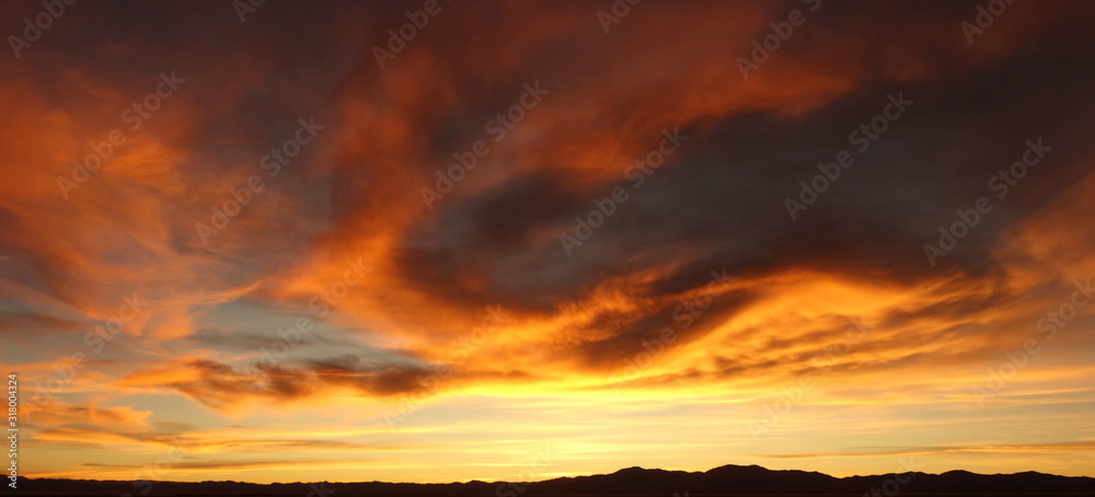 Magical sunset on the roadway to Salinas grandes (large salines) on the north of argentina - obrazy, fototapety, plakaty 