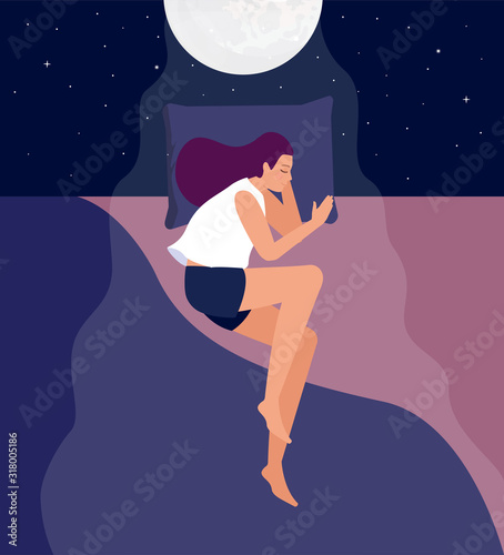 The girl sleeps in her bed under the moonlight.