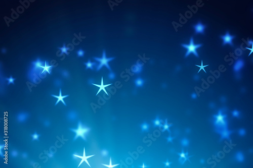 Abstract blue Christmas background. Stars bokeh particles and light. New year 2020