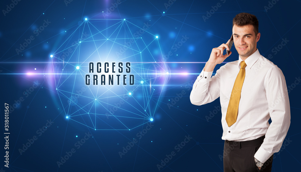Businessman thinking about security solutions with ACCESS GRANTED inscription Businessman thinking about security solutions with ACCESS GRANTED inscription