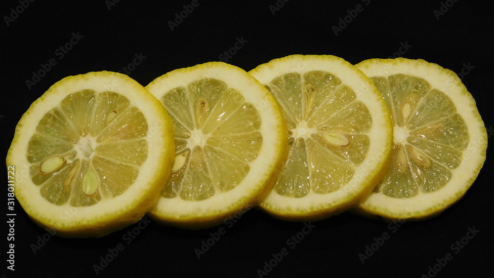 lemon slices on a black background close-up lemon slices on a black background close-up