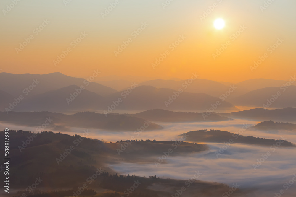 mountain valley in a clouds at the early morning, mountain sunrise background mountain valley in a clouds at the early morning, mountain sunrise background