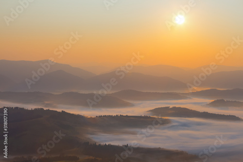 mountain valley in a clouds at the early morning, mountain sunrise background