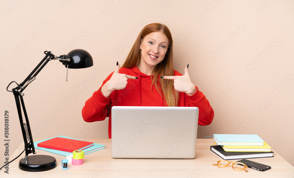 Young student woman in a workplace with a laptop proud and self-satisfied Young student woman in a workplace with a laptop proud and self-satisfied